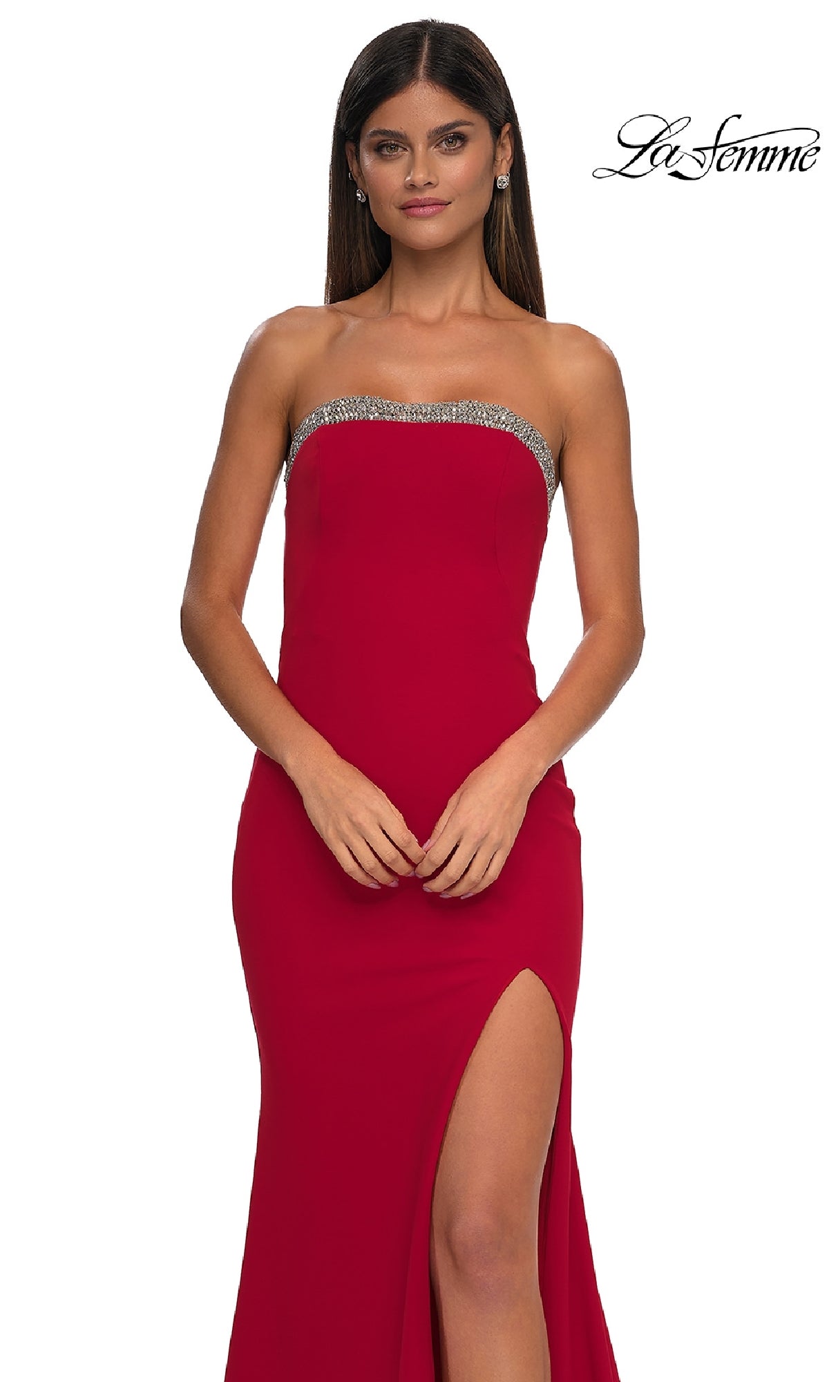 Woman wearing the Bead-Trimmed Long Prom Dress: La Femme 32891, featuring a strapless neckline, rhinestone trim, and high slit, poses against a white background with the